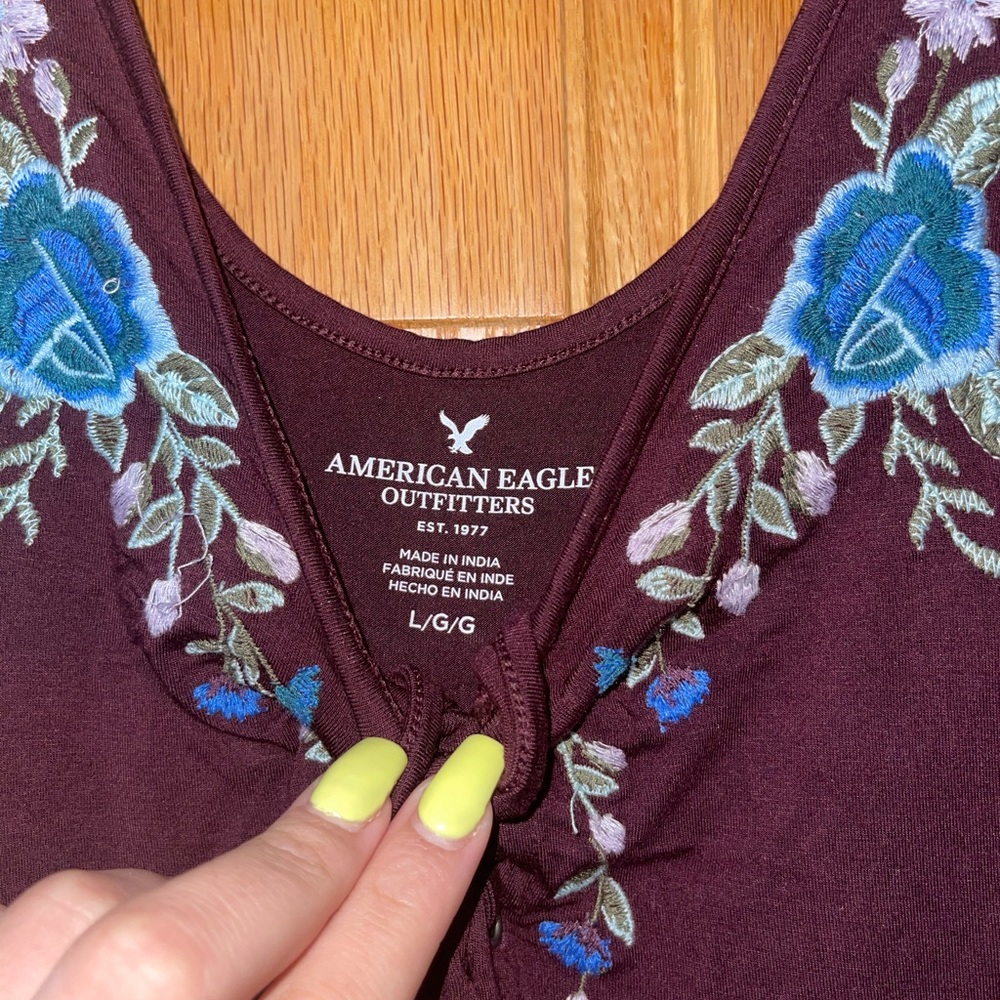 American Eagle maroon bodysuit with floral design!